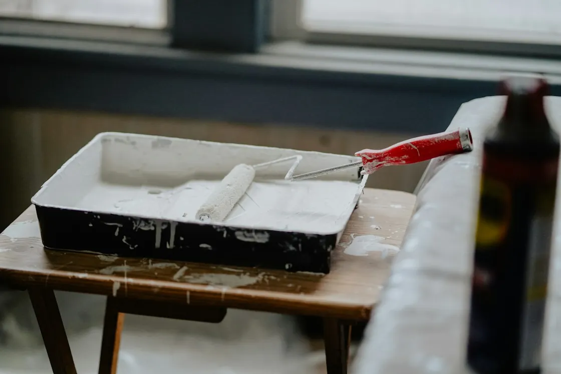 Paint roller and tray ready for renovation work.